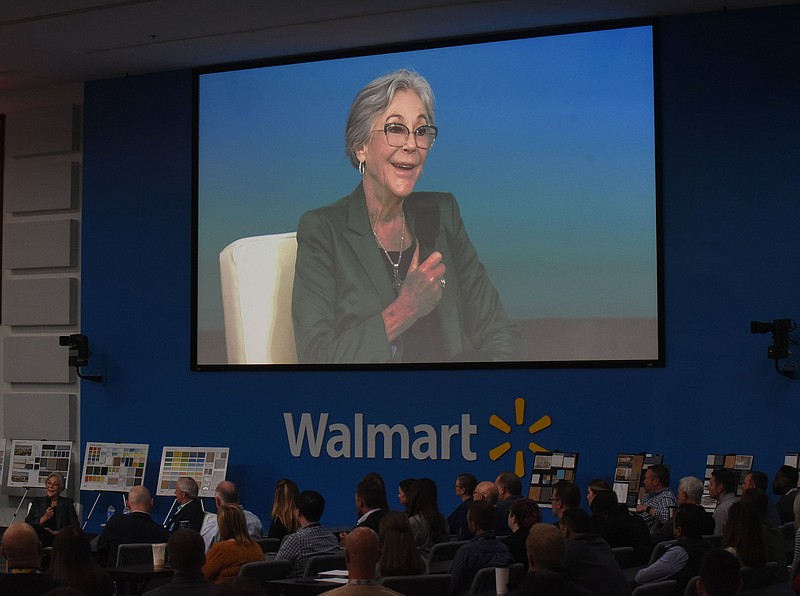 Alice Walton (seated at left) talks Wednesday April 6 2002 at the Walmart Home Office in Bentonville about the Walton Family Whole Health and Fitness center and other amenities of the new home office under construction east of the current home office. Go to nwaonline.com/220407Daily/ to see more photos.
(NWA Democrat-Gazette/Flip Putthoff)