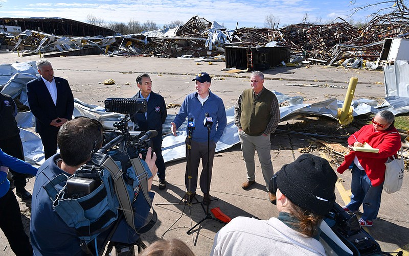 Gov. Asa Hutchinson (center) speaks Thursday, April 7, 2022, alongside Springdale Mayor Doug Sprouse (right) and A.J. Gary, director of the Arkansas Department of Emergency Management, after touring tornado damage at Nilfisk-Advance in Springdale. The business was heavily damaged after a tornado touched down early in the morning of March 30. Visit nwaonline.com/220408Daily/ for today's photo gallery. 
(NWA Democrat-Gazette/Andy Shupe)