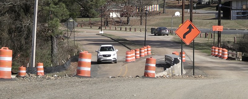 Vehicles make their way through road construction in the Albert Pike Road area in January. - File photo by Donald Cross of The Sentinel-Record