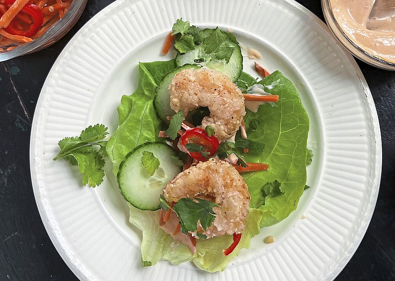Cornstarch-dusted fried shrimp is the star of these easy-to-compose lettuce wraps with pickled veggies. (TNS/Pittsburgh Post-Gazette/Gretchen McKay)