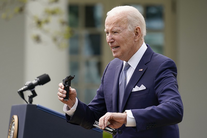 President Joe Biden holds pieces of a 9mm pistol as he speaks in the Rose Garden of the White House in Washington, Monday, April 11, 2022. Biden announced a final version of the administration&#x2019;s ghost gun rule, which comes with the White House and the Justice Department under growing pressure to crack down on gun deaths. (AP Photo/Carolyn Kaster)