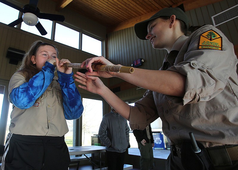 Arkansas State Park interpreter Melissa Ray helps Boys Scout McKenzie Parish, 14, aim a blow gun before shooting it during the Boy Scout Indian Lore Merit Badge workshop on Saturday, Jan. 25, 2020, at the Toltec Mounds Archeological State Park in Scott. 
See more photos at www.arkansasonline.com/126toltec/
(Arkansas Democrat-Gazette/Thomas Metthe)