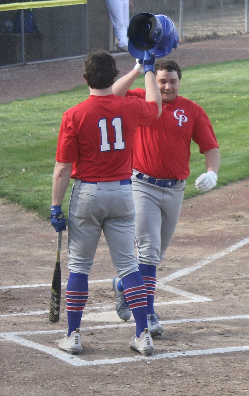 Junior Hunter Berendzen (right) hits his second home run of the season to give the Pintos a 1-0 lead.