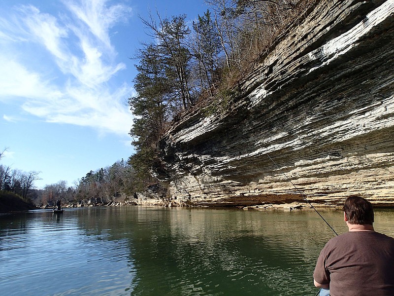 White River and War Eagle River, major tributaries of Beaver Lake, are prime destinations for walleye and white bass fishing. Anglers including Alan Bland (right) fish for walleye in mid March 2022 along the War Eagle River.