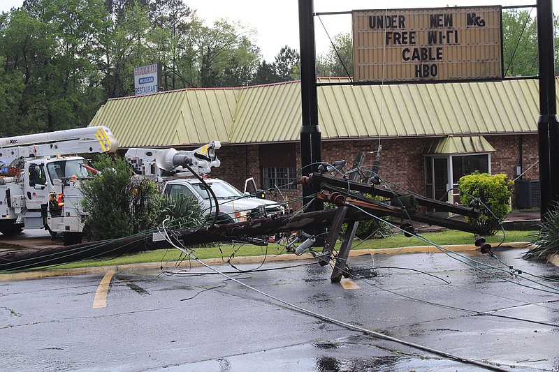 Photo by Michael Hanich
Downed power lines littered the area around Americas Best Value Inn after a storm passed through Camden causing power outages.