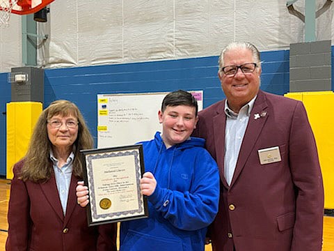 Nathaniel Charles Clasen (center), a sixth grade student at McNair Middle School in Fayetteville, placed first in Fayetteville/Springdale Elks Lodge 1987’s Americanism essay contest. This year’s theme was “What does it mean to love your country?” His essay went on to state competition, where he took first place in Division I, and he received a check for $200. His essay will go on to the national competition. Pictured from left to right are Marge Guist, Americanism/Youth Activities at the lodge; Clasen; and Joe Hayes, trustee at the lodge.

(Courtesy photo)