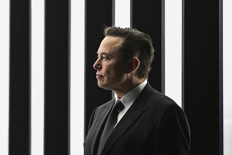 Elon Musk, Tesla CEO, attends the opening of the Tesla factory Berlin Brandenburg in Gruenheide, Germany, March 22, 2022.  Twitter said in a statement Friday, April 15, 2022,  that its board of directors has unanimously adopted a “poison pill” defense in response to Tesla CEO Elon Musk’s proposal to buy the company and take it private.   (Patrick Pleul/Pool Photo via AP, File)