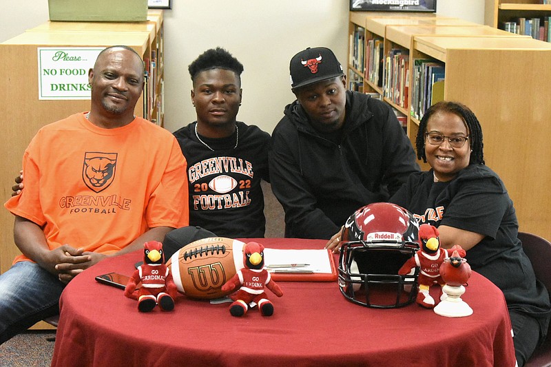 Eddie Collins Jr., second from left, signed a letter of intent with Greenville (Ill.) College on Monday at Dollarway High School. Supporting him, from left: uncle Cedric Carter, cousin Khalil Carter and aunt Marchella Carter. (Pine Bluff Commercial/I.C. Murrell)