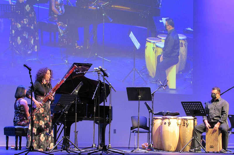 Members of SoNA, led by Lia Uribe (left), perform for SoNA Beyond: Voces Latinas earlier this year at the Fayetteville Public Library. SoNA has big plans for the Beyond series this summer.

(Courtesy Photo)