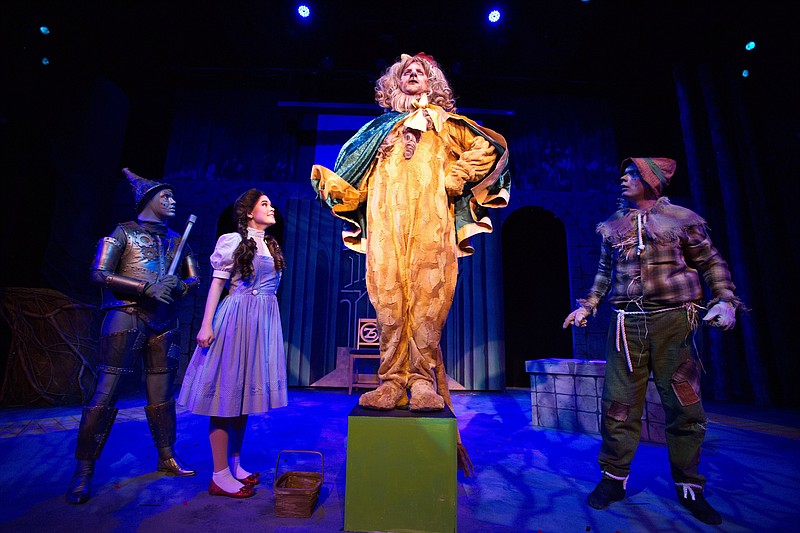 Caroline Perry (from left) as the Tinman, Madisyn Sallas as Dorothy Gale, Brandon Nichols as the Cowardly Lion and Matthew Sewell as the Scarecrow speculate on what will happen when the Lion becomes "King of the Forest"  in “The Wizard of Oz” at Argenta Commuity Theater.

(Special to the Democrat-Gazette/Royce West)