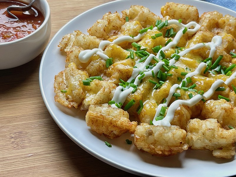 Tater Tot Waffle topped with cheddar cheese, chives and sour cream. (Arkansas Democrat-Gazette/Kelly Brant)