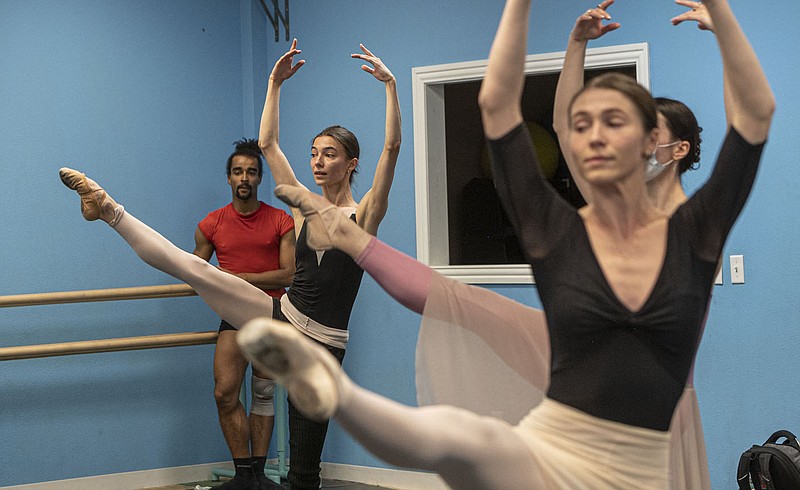 Tsembenhoi Arno-Stin, From Left and Rodina Anastasia, ballet dancers from the Ukarine, practice Thursday with freelance dancers working with the Ozark Ballet Theatre in Bentonville.(NWA Democrat-Gazette/Spencer Tirey)