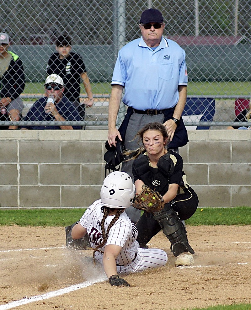 Westside Eagle Observer/RANDY MOLL
Gentry junior Maddi Voyles slides across home plate just ahead of the West Fork catcher's tag for another of Gentry's 15 runs in the Lady Pioneer home victory on Thursday.