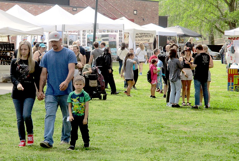 Marc Hayot/Siloam Sunday Small crowds gather on Friday downtown for the start of the 2022 Dogwood Festival. The festival will be held Friday through Sunday and will have a variety of activities, events and vendors.