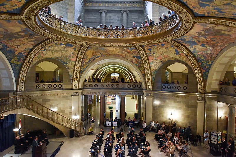 Julie Smith/News Tribune
Friends and family lined the second and third floor rotunda railing as their loved ones prepared to take the oath as an attorney during a Capitol ceremony Friday.