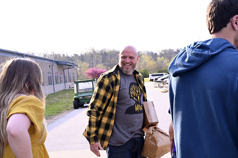 In this photo provided by courtesy of MacArthur Justice Center, Michael Politte smiles after being released on parole on Friday, April 22, 2022, at the Jefferson City Correctional Center in Jefferson City, Mo. He has been behind bars for nearly two decades after being convicted at age 14, in the 1998 death of his mother Rita Politte. He and his supporters have long maintained his innocence and claimed his conviction was based on now-disproven scientific evidence. (Egan O'Keefe/Courtesy MacArthur Justice Center via AP)