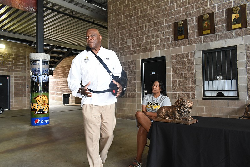 UAPB Athletic Director Chris Robinson addresses athletic supporters as women's basketball Coach Dawn Thornton listens Saturday, April 23, 2022, in the breezeway of Simmons Bank Field. (Pine Bluff Commercial/I.C. Murrell)