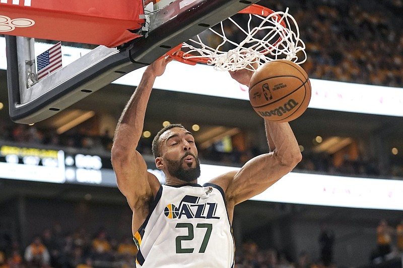 Utah Jazz center Rudy Gobert (27) dunks against the Dallas Mavericks in the second half of Game 4 of an NBA basketball first-round playoff series, Saturday, April 23, 2022, in Salt Lake City. (AP Photo/Rick Bowmer)