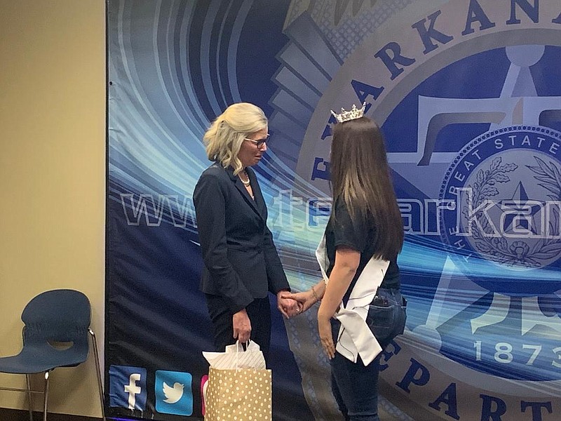 Kalyx Cantu, Miss Northeast Texas Outstanding Teen, presents a gift to Assistant Bowie County District Attorney Kelly Crisp for believing in her and fighting for her during a sexual assault case. (Staff photo by Lori Dunn)