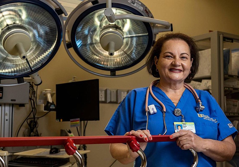 Marta Madrazo has been a registered nurse since 1984. She has been with Baptist since 2004. She works in the emergency department, helping to triage patients, care for them and make sure the flow of patient care is efficient. (Jose A. Iglesias/Miami Herald/TNS)