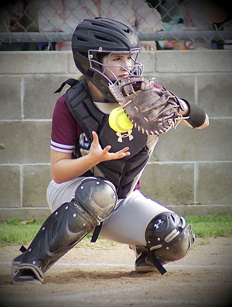 Westside Eagle Observer/RANDY MOLL
Audrie Littlejohn drops the ball from her glove to her throwing hand after catching a pitch during play against Pea Ridge in Gentry on April 27.