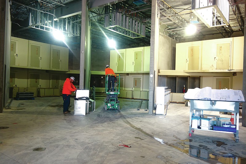 Crew members work in what will be the general population holding area for the new Callaway County Jail, which is currently under construction. FULTON SUN/MICHAEL SHINE