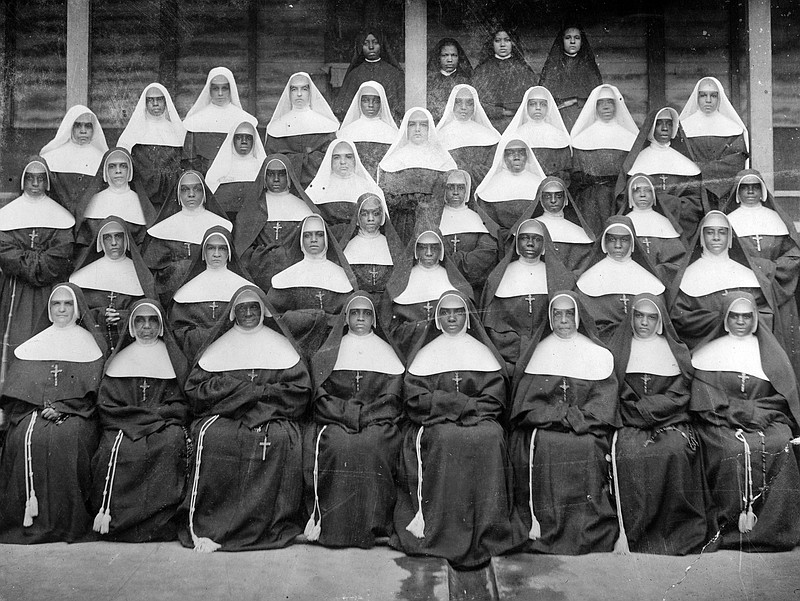 This 1898 photo provided by the Sisters of the Holy Family (SSF) shows members of the religious order of African-American nuns in New Orleans. One of the oldest Black sisterhoods, the SSF, formed in New Orleans in 1842 because white sisterhoods in Louisiana, including the slave-holding Ursuline order, refused to accept African Americans. (SSF via AP)
