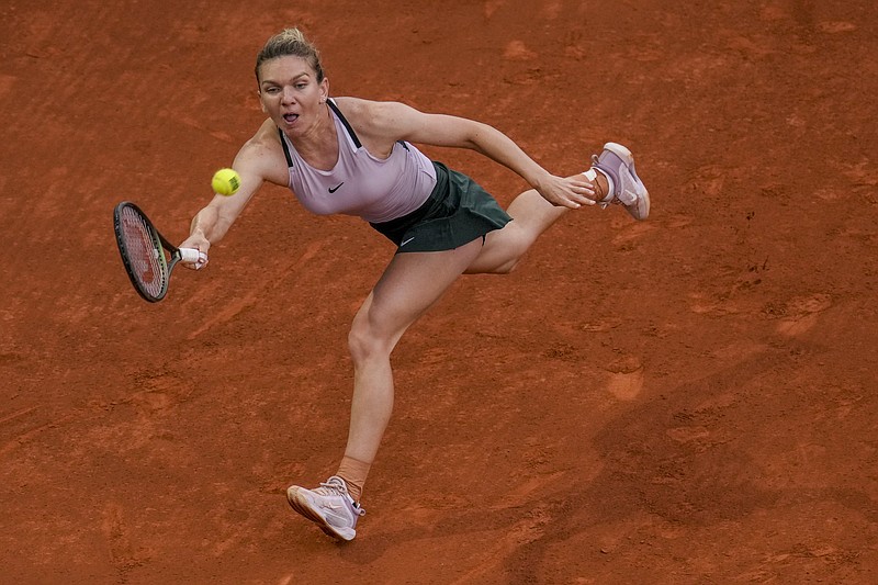 Simona Halep, of Romania, returns the ball against Paula Badosa of Spain during their match at the Mutua Madrid Open Saturday in Madrid, Spain. - Photo by Manu Fernandez of The Associated Press