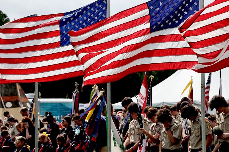 American flags fly during the opening prayer ceremony at the 55th Scout-O-Rama on Saturday, April 30, 2022, at Spring Lake Park in Texarkana, Texas. (Photo by JD)