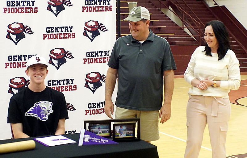 Westside Eagle Observer/RANDY MOLL
With his parents Brent and Katerina Walker looking on, Gentry senior Bart Walker, on Thursday, signed a letter of intent to play baseball for Southwest Baptist University in Bolivar, Mo., next year.