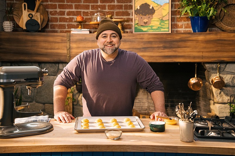 On Food Network’s new daytime series, “Duff: Ace of Taste,” celebrity chef Duff Goldman is expanding his horizons to share savory recipes too. Seen here, host Duff Goldman with choux pastry buns as seen on "Ace of Taste." (Rob Pryce/Food Network/TNS)