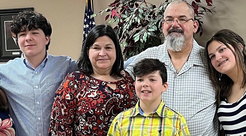 John Badgley (second from right) was presented with the White Hall Chamber of Commerce?s W.F. ?Jack? Moody award two weeks early because he has brain cancer and was scheduled for surgery the next day. The family photo included his grandson, Landon James (left) wife, Christy Badgley, grandson, Kadon James (center front) Badgley, and daughter Kayla Badgley. (Special to The Commercial)