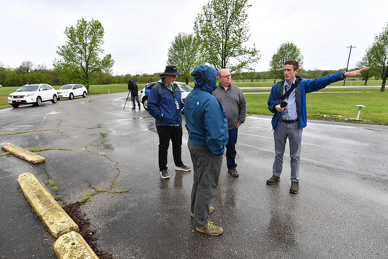 Jonathan Curth (right), development services director for the city of Fayetteville, leads a tour Monday, May 2, 2022, of the 112 Drive-In in north Fayetteville. The City Council had on its agenda Tuesday rezoning about 22 acres at the site of the longstanding drive-in theater. Visit nwaonline.com/220504Daily/ for today's photo gallery. 
(NWA Democrat-Gazette/Andy Shupe)