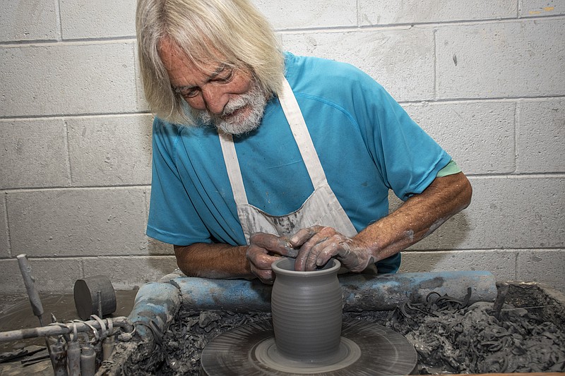 James Kimberly “Kimbo” Dryden throws a pot at Dryden Pottery in Hot Springs. The potter was named the 2022 Arkansas Living Treasure by the Arkansas Arts Council. (Arkansas Democrat-Gazette/Cary Jenkins)