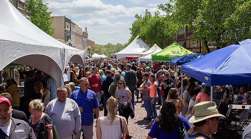 A crowd swarms Court Street in downtown Fulton for a previous Morels and Microbrews. The event will take place this weekend in downtown Fulton. FILE PHOTO