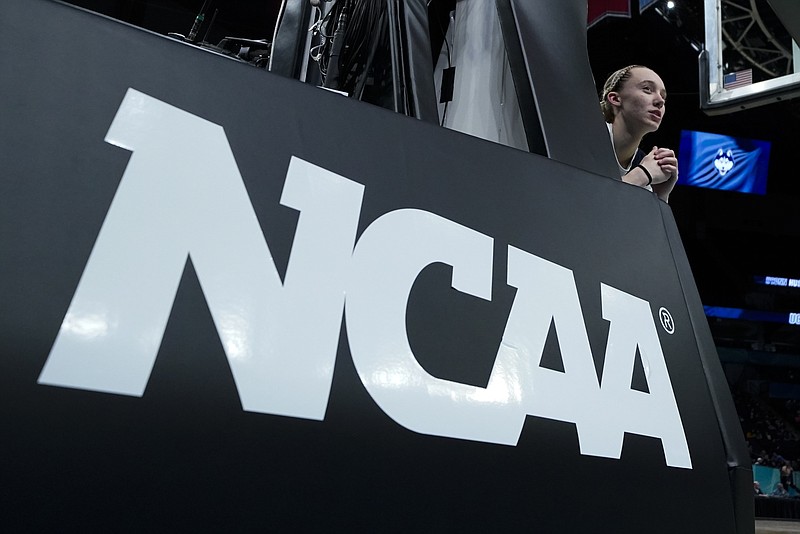 FILE - UConn's Paige Bueckers stretches during a practice session for a college basketball game in the final round of the Women's Final Four NCAA tournament April 2, 2022, in Minneapolis. In 2019, California became the first state to pass a law allowing athletes to earn money on endorsements, autograph signings and other activities, and by July 2021, the NCAA lifted its decades-old ban. (AP Photo/Eric Gay, File)