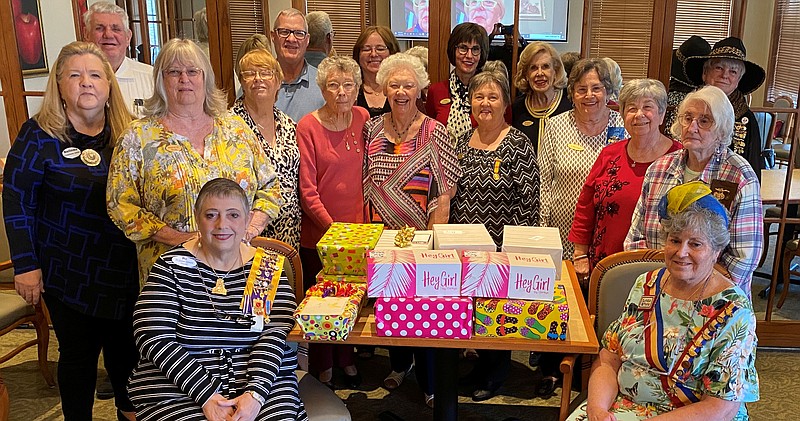 Members of three organizations display the shoe box gifts for the Arkansas School for the Deaf. (Special to The Commercial)