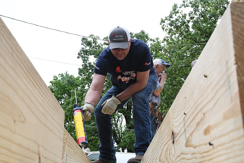 Danny Bennett, substation technician with Entergy, volunteers with Garland County Habitat for Humanity. - Photo by Tanner Newton of The Sentinel-Record
