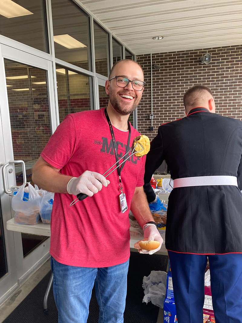 PHOTO PROVIDED BY KEN SCHUTTEN. Joseph Beachner making hamburgers for MCHS' "Decision Day." Beachner helped coordinate the event with rootEd.