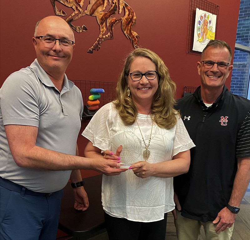 PHOTO PROVIDED BY KEN SCHUTTEN. Frank Woods, Audrey Cloud, and Dr. Mark Stanton with Cloud's Teacher of the Year trophy. Cloud said being Teacher of the Year is a honor that she didn't expect.