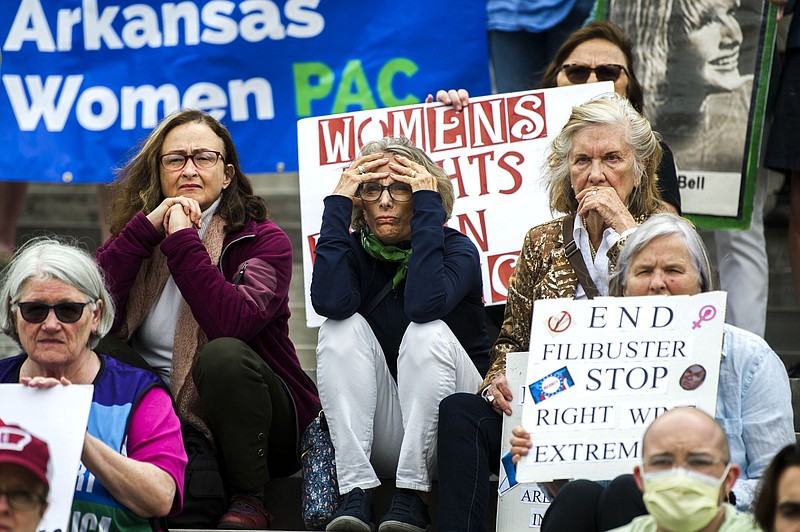 Protesters listen to speakers discuss reproductive rights during a protest on the steps of the Arkansas State Capitol in response to a leaked Supreme Court decision overturning Roe V. Wade on Tuesday, May 3. (Arkansas Democrat-Gazette/Stephen Swofford)