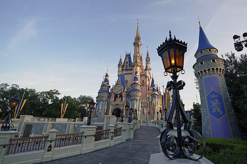 The newly painted Cinderella Castle at the Magic Kingdom at Walt Disney World is seen with the the crest to celebrate the 50th anniversary of the theme park in this file photo from Aug. 30, 2021, in Lake Buena Vista, Fla.

(AP)