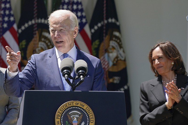 President Joe Biden speaks at an event on lowering the cost of high-speed internet in the Rose Garden of the White House, Monday, May 9, 2022, in Washington. Vice President Kamala Harris applauds at right. (AP Photo/Manuel Balce Ceneta)