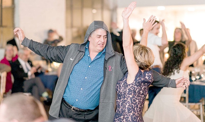 Photo submitted Bryan Truitt (left), and his. wife Stephanie dance during The Main Event 2018. This year's Main Event's theme will be "Swingin' in the Springs" and will be held at 7 p.m. on Friday, May 20 at the Park House Kitchen + Bar.