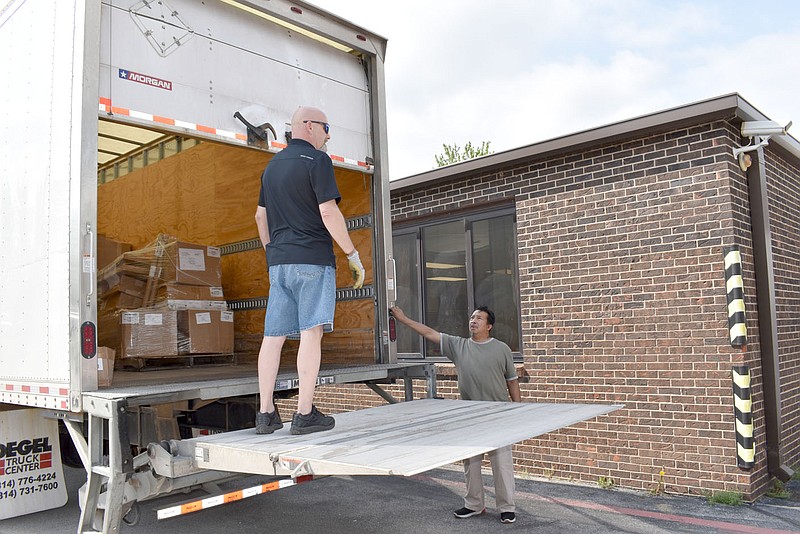 RACHEL DICKERSON/MCDONALD COUNTY PRESS Workers unload supplies from Catapult Learning at McDonald County High School on Tuesday for the Summer Journey summer school program.