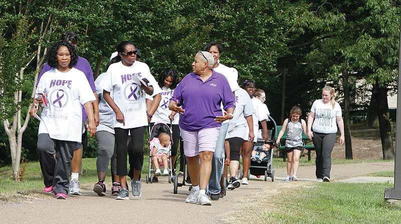 Walkers complete laps at Old City Park during the 2016 'Walk To End Lupus' event in this News-Times file photo.