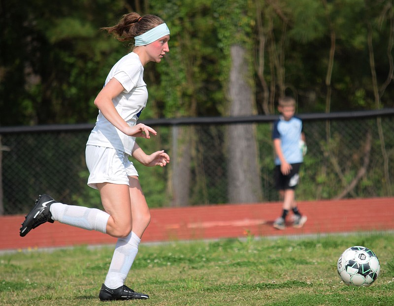Westside Eagle Observer/MIKE ECKELS
Lady Bulldog Lorelai Tuinstra drives the ball toward the Lady Highlander defended goal during the second half of the Eureka Springs-Decatur soccer match in Eureka Springs May 9. The Bulldogs took the conference win 5-0.