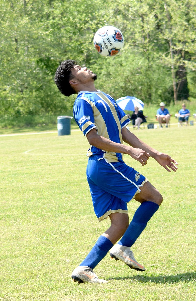 Westside Eagle Observer/MIKE ECKELS
Bulldog forward Steven Lucero bounce passes the ball off of his head during the Decatur-Buffalo Island Central first round soccer match of the 3A state soccer playoffs in Harrison Thursday morning. The Bulldogs took the win 4-2 over the Mustangs.