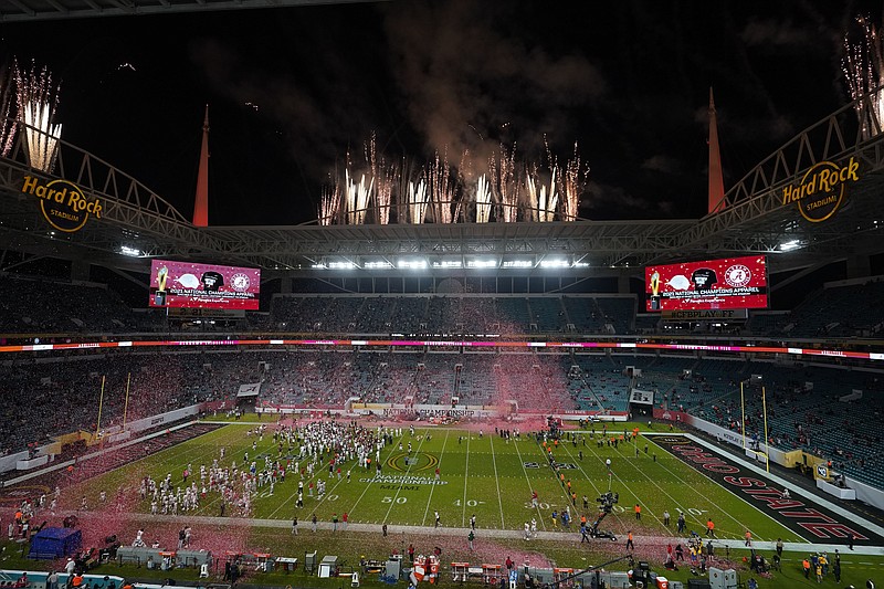 FILE - Alabama celebrates after their win against Ohio State in an NCAA College Football Playoff national championship game, Monday, Jan. 11, 2021, in Miami Gardens, Fla. College football and men's basketball players on scholarship in one of the major conferences can expect to soon earn a minimum of $50,000 each year he plays because of the influx of cash from so-called booster collectives brokering name, image and likeness deals.That prediction, based on market trends, was made this week by Blake Lawrence, co-founder and CEO of a company that helps athletes and schools navigate the ever-changing NIL landscape. (AP Photo/Wilfredo Lee)