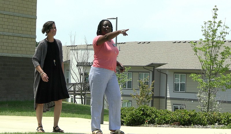 NPC admissions specialist and president of the Helping Hawks food pantry, Tikima Simpkins, at right, shows a prospective student around campus last week. - Photo by Andrew Mobley of The Sentinel-Record